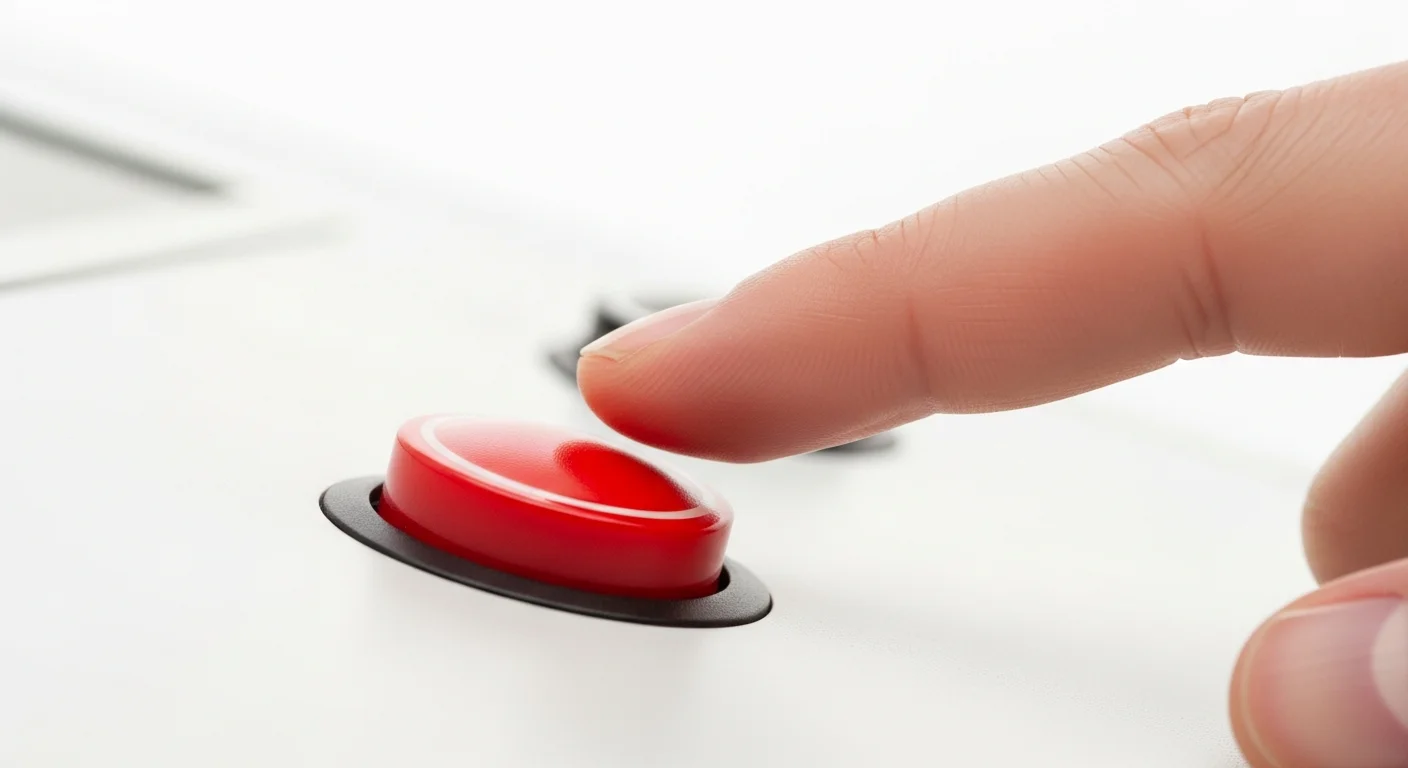 Dedo prestes a pressionar botão vermelho em painel branco — representando o erro de mexer na campanha durante o período de aprendizado do Google Ads