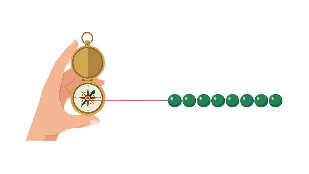 Mãos segurando bússola de latão sobre mesa com fileira de bolinhas verdes alinhadas.